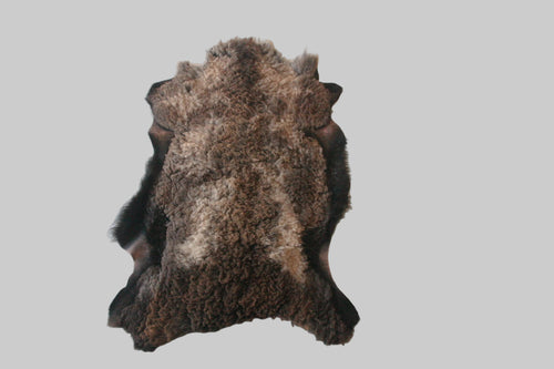 Brown animal skin rug on a light-colored floor